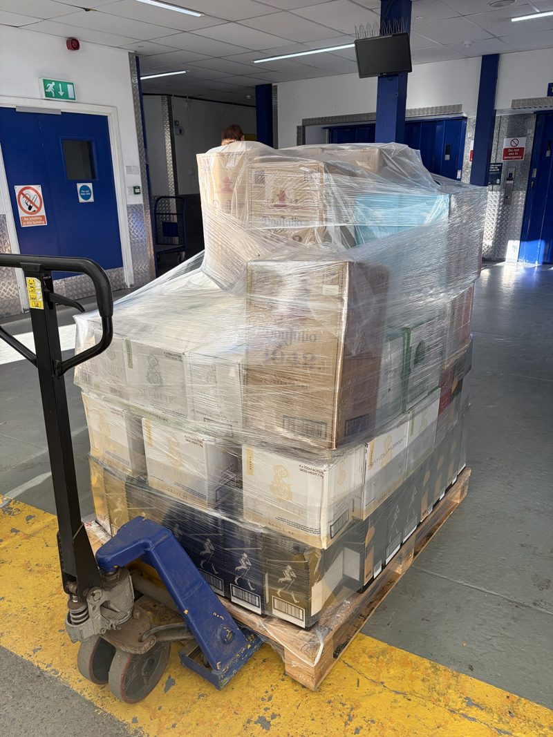 Pallet of mixed premium spirits on a pallet truck