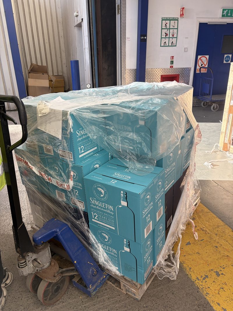 Pallet of single malt Scotch whisky on a pallet truck